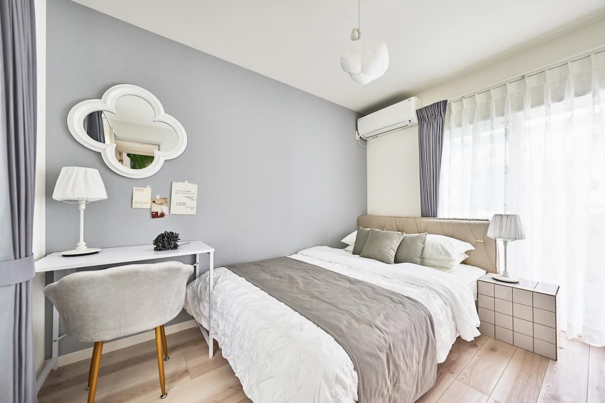Bedroom with double bed and soft gray tones
